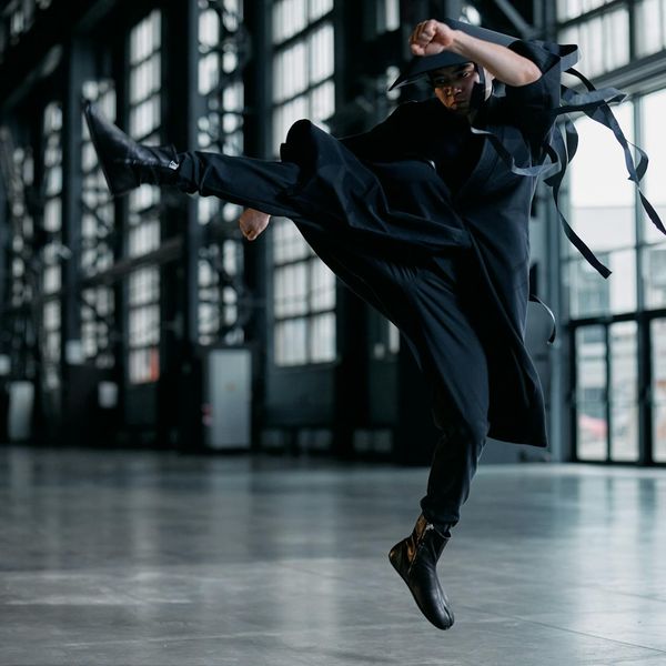 Strong man performing a functional movement sequence.